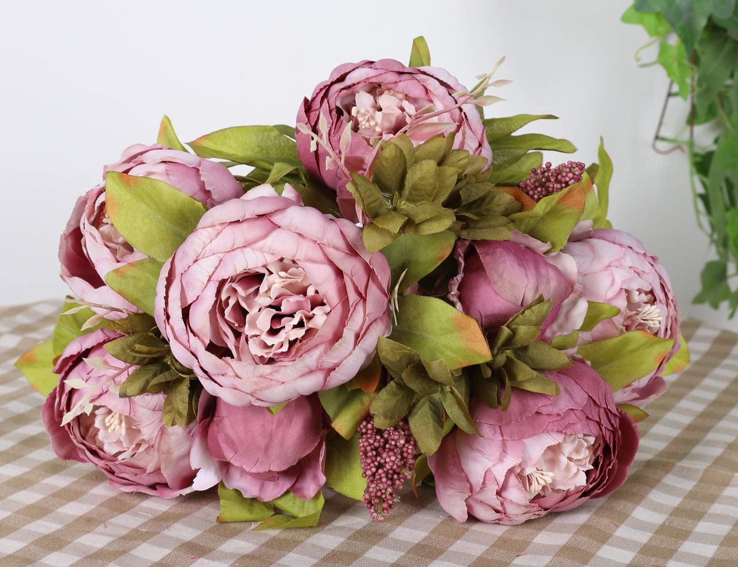 Vintage silk flowers arranged in a vase